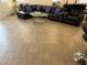 Open-concept floor plan with a comfortable sofa and tile flooring at 777 Star Apple Ln, Las Vegas, NV 89178