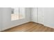Cozy bedroom with hardwood floors, window, and closet at 8312 Raphael Ct, Las Vegas, NV 89129