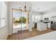 Open kitchen with white cabinets, stainless steel appliances, and a view of the backyard pool at 8312 Raphael Ct, Las Vegas, NV 89129