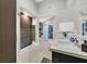 Bathroom featuring marble countertops, a glass-enclosed shower, and access to a walk-in closet at 8370 Plum Creek Ct, Las Vegas, NV 89113