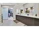 A bright bathroom featuring double sinks, lots of drawer space and a walk-in closet at 8370 Plum Creek Ct, Las Vegas, NV 89113