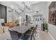 Bright, open dining area with modern lighting and view into the kitchen at 8370 Plum Creek Ct, Las Vegas, NV 89113