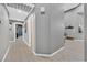 Hallway with hardwood floors, neutral paint, and an entry to several rooms of the home at 8370 Plum Creek Ct, Las Vegas, NV 89113
