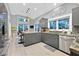 Modern kitchen with stainless steel appliances, granite countertops, and a breakfast bar at 8370 Plum Creek Ct, Las Vegas, NV 89113