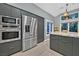 Bright kitchen with stainless steel refrigerator and oven, plus granite countertop island at 8370 Plum Creek Ct, Las Vegas, NV 89113