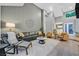 Bright living room with high ceilings, stylish furniture, and an inviting atmosphere at 8370 Plum Creek Ct, Las Vegas, NV 89113