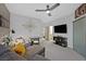 Relaxing living room with a gray sofa, a flat-screen TV, and modern decor at 8370 Plum Creek Ct, Las Vegas, NV 89113
