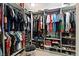 Walk-in closet featuring custom shelving, ample storage space, and plenty of room for clothes, shoes, and accessories at 8370 Plum Creek Ct, Las Vegas, NV 89113