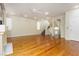 Spacious living room with hardwood floors, recessed lighting, a decorative fireplace, and a staircase at 8467 Bismark Sapphire St, Las Vegas, NV 89139