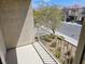 Balcony view of the community featuring plants, greenery and a street view at 8865 Knickknack Ct, Las Vegas, NV 89149