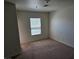 Carpeted bedroom featuring natural light from a window at 8865 Knickknack Ct, Las Vegas, NV 89149