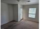 Spacious bedroom with neutral carpet, natural light, and access to a balcony at 8865 Knickknack Ct, Las Vegas, NV 89149