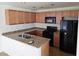 Functional kitchen with ample cabinet space, granite countertops, and essential appliances at 8865 Knickknack Ct, Las Vegas, NV 89149