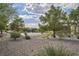 Well-maintained basketball court surrounded by trees and landscaping in a Gathering-friendly community at 9053 Starling Wing Pl, Las Vegas, NV 89143