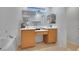 Bright bathroom with tile floor, a bathtub and shower, plus a vanity with double sinks at 9053 Starling Wing Pl, Las Vegas, NV 89143