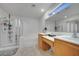 Bathroom features combined bathtub and shower plus dual sink vanity at 9053 Starling Wing Pl, Las Vegas, NV 89143