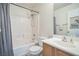 Bathroom featuring a shower over tub and modern sink at 9053 Starling Wing Pl, Las Vegas, NV 89143