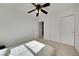 Bedroom featuring a ceiling fan, closet, and carpeted floors at 9053 Starling Wing Pl, Las Vegas, NV 89143