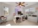 Bright bedroom featuring a ceiling fan, carpeted floor and lots of natural light at 9053 Starling Wing Pl, Las Vegas, NV 89143
