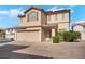 Charming two-story home featuring a two-car garage and a well-maintained front yard at 9053 Starling Wing Pl, Las Vegas, NV 89143