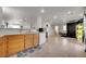 Bright eat-in kitchen features tile flooring, wooden cabinets, and stainless steel dishwasher at 9053 Starling Wing Pl, Las Vegas, NV 89143