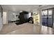 Open-concept living area with sliding glass doors, carpet and tile floors at 9053 Starling Wing Pl, Las Vegas, NV 89143