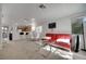 Open living space with a modern sofa, glass table, and seamless connection to the kitchen at 9053 Starling Wing Pl, Las Vegas, NV 89143