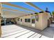 Backyard showcasing a covered patio area with ample space for seating and outdoor activities at 925 Alan Shepard St, Las Vegas, NV 89145