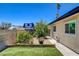 This well-maintained backyard with artificial turf and manicured landscaping is perfect for outdoor enjoyment at 925 Alan Shepard St, Las Vegas, NV 89145