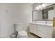 This bathroom features a double vanity, modern lighting, and updated fixtures, making it a perfect space for relaxation and comfort at 925 Alan Shepard St, Las Vegas, NV 89145