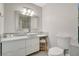 Bright bathroom features a white vanity with vessel sink, a decorative mirror, and a tiled backsplash and flooring at 925 Alan Shepard St, Las Vegas, NV 89145