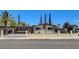Charming single-story home featuring desert landscaping, and a wrought iron fence at 925 Alan Shepard St, Las Vegas, NV 89145