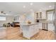 Spacious kitchen featuring an island with seating and stainless steel appliances at 925 Alan Shepard St, Las Vegas, NV 89145