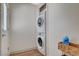 A convenient laundry area with a stacked washer and dryer at 925 Alan Shepard St, Las Vegas, NV 89145
