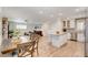 Open concept layout with kitchen island, dining area, and living room at 925 Alan Shepard St, Las Vegas, NV 89145