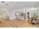 Open concept living space featuring island kitchen, dining area and hardwood floors at 925 Alan Shepard St, Las Vegas, NV 89145