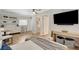 Comfortable living space featuring a TV, breakfast table and kitchenette with modern finishes at 925 Alan Shepard St, Las Vegas, NV 89145