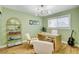 This home office has plenty of natural light and a modern desk space perfect for productivity and creativity at 925 Alan Shepard St, Las Vegas, NV 89145
