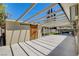 Spacious covered patio featuring a decorative wood door and ample room for outdoor entertaining at 925 Alan Shepard St, Las Vegas, NV 89145