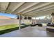 This patio offers an ideal space for relaxation, featuring comfortable seating and inviting views of the backyard at 925 Alan Shepard St, Las Vegas, NV 89145