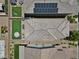 An aerial view of a tiled roof, a solar-paneled roof, and a well-kept backyard at 9730 Cluny Ave, Las Vegas, NV 89178