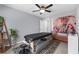 This bedroom is staged as a relaxation room and features a massage table, bench and decor at 9730 Cluny Ave, Las Vegas, NV 89178