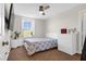 This comfortable bedroom is complete with carpeted floors and a ceiling fan, offering comfort and functionality at 9730 Cluny Ave, Las Vegas, NV 89178
