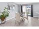 Bright dining area with modern furnishings and a view of the backyard at 9730 Cluny Ave, Las Vegas, NV 89178