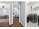 This hallway shows entryways into bedrooms and the laundry room at 9730 Cluny Ave, Las Vegas, NV 89178