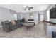Spacious living area with a plush sectional sofa and ample natural light at 9730 Cluny Ave, Las Vegas, NV 89178