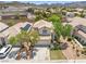 Aerial view of a home with solar panels and lush green trees in a suburban neighborhood at 981 Leadville Meadows Dr, Henderson, NV 89052