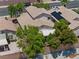 Aerial view showcasing a well-maintained home with a patio and desert landscaping at 981 Leadville Meadows Dr, Henderson, NV 89052