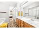 Bathroom with double vanity, soaking tub, and a separate shower; plus wood-look floors at 981 Leadville Meadows Dr, Henderson, NV 89052