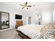 Nicely decorated bedroom featuring a large bed, carpet flooring and flatscreen TV at 981 Leadville Meadows Dr, Henderson, NV 89052